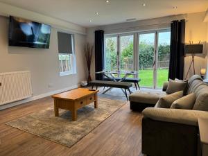 a living room with a couch and a table at The Beresford Arms in Morpeth