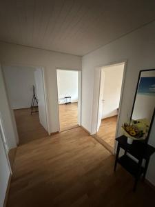 an empty room with a room with a table and a tripod at Zurich 2 Bedrooms Apartment in Zürich