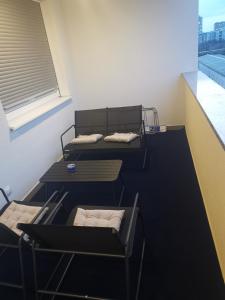 two beds in a room with a window at Katia in Zagreb