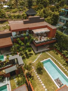 an aerial view of a house with a swimming pool at Lasai Villas in Gili Air
