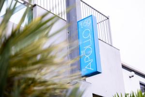 a blue sign on the side of a building at The Apollo in Apollo Bay