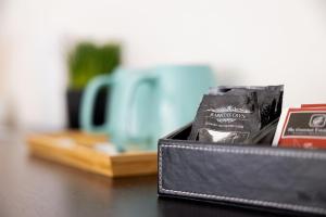 a black wallet sitting on top of a table at The Apollo in Apollo Bay