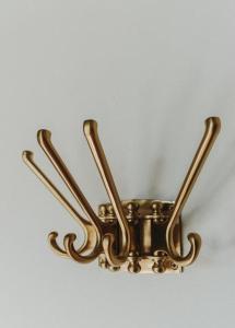 a bronze light fixture hanging from a ceiling at Kasteelhof van Loppem in Loppem