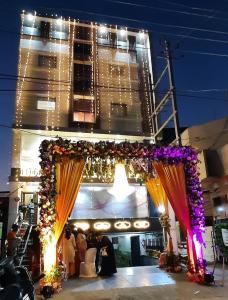 a wedding ceremony in front of a building at HOTEL SIDDHALI INN in Jabalpur