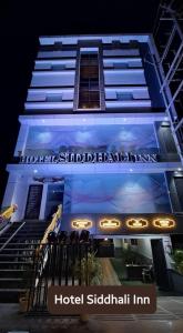 a hotel shadiadi inn is lit up at night at HOTEL SIDDHALI INN in Jabalpur