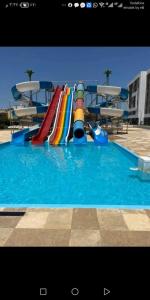 a water slide in a swimming pool at فنادير in Hurghada