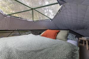 a room with a bed in a tent at Glamping escape to the stars under Prague skyline in Prague