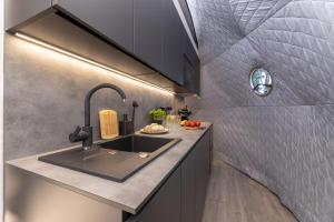 a kitchen with a sink and a counter at Glamping escape to the stars under Prague skyline in Prague