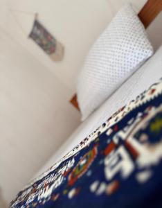 a close up of a bed in a bedroom at Karibu Africa Home in Moshi