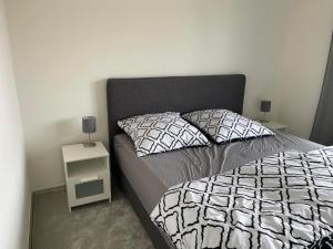 a bedroom with a bed with two night stands at Ferienwohnung Lara in Bad Breisig