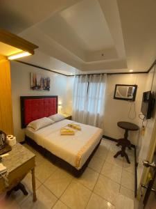 Postel nebo postele na pokoji v ubytování Sugarland Suites