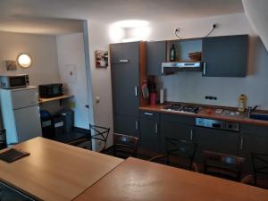 a kitchen with a table and a counter top at Ferienwohnungen Stiehl in Bacharach