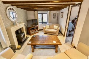 a living room with a couch and a coffee table at The Old Granary Seahouses in North Sunderland