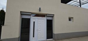 a white door on the side of a building at Sen's Studio in Leskovac