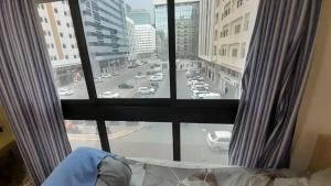 a view of a city street from a window at ADMFHR5 in Abu Dhabi