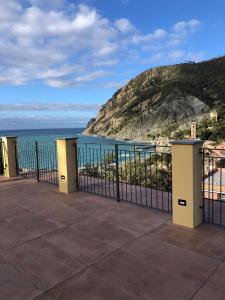 a view of the ocean from a balcony at Fiordarancio Room Rental in Monterosso al Mare +10 photos