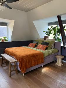 En eller flere senge i et værelse på B&B Het Oude Dorpscafé