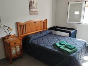 Katil atau katil-katil dalam bilik di Casa rural miralmonte