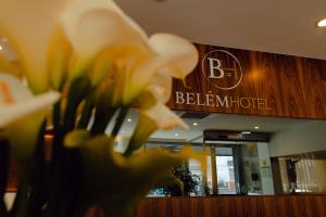 a blurry picture of a hotel lobby with a flower at Belem Hotel in Pombal