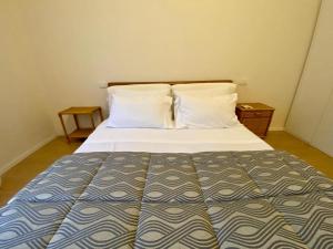 Postel nebo postele na pokoji v ubytování Gigi's Place