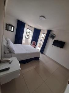 Postel nebo postele na pokoji v ubytování Hotel Suite Santa Rosa