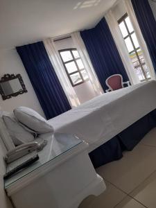 Postel nebo postele na pokoji v ubytování Hotel Suite Santa Rosa