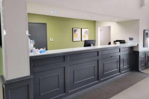 a reception counter in a dental office at Super 8 by Wyndham Aurora/Naperville Area in Aurora