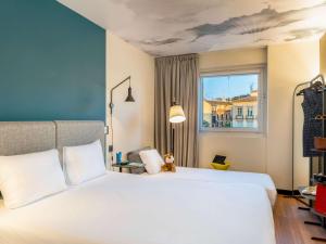 Posteľ alebo postele v izbe v ubytovaní Ibis Malaga Centro Ciudad