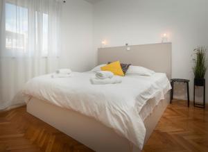 Posteľ alebo postele v izbe v ubytovaní Apartman PeTaDo