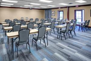 a classroom with tables and chairs in a room at Hyatt House Boston/Burlington in Burlington