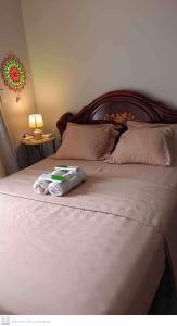 een bed met een paar vouwhanddoeken erop bij Adam&Eva Condo Staycation in Lapu Lapu City