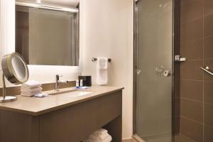 a bathroom with a sink and a shower at Hyatt House Emeryville in Emeryville