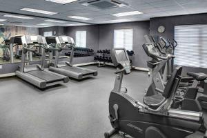 a gym with treadmills and elliptical machines at Hyatt House Morristown in Morristown