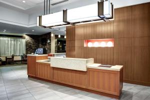 a lobby with a reception desk in a building at Hyatt Place Columbia/Downtown/The Vista in Columbia
