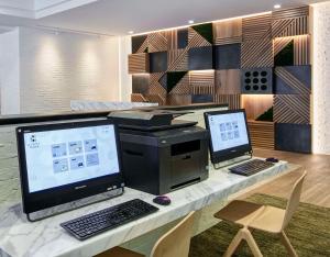 an office with a desk with a computer and a printer at Hyatt Place Chicago River North in Chicago