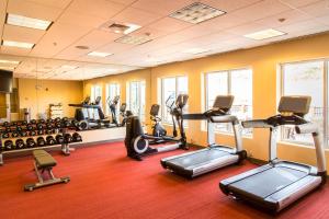a gym with several treadmills and exercise bikes at Hyatt Place Charlottesville in Charlottesville