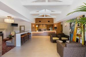 a lobby of a hotel with couches and a bar at Hyatt House San Ramon in San Ramon