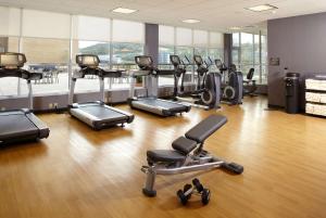 a gym with a bunch of exercise equipment in it at HYATT House Pittsburgh-South Side in Pittsburgh