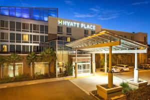 a hotel with a parking lot in front of it at Hyatt Place San Diego-Vista/Carlsbad in Vista