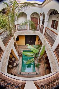 an overhead view of a building with a swimming pool at Riad Aguaviva in Marrakech
