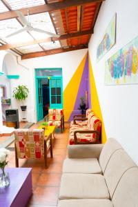 a living room with a colorful wall at Casa Blanca Hostel in Tarija