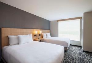 Postel nebo postele na pokoji v ubytování Hyatt Place Austin Lake Travis/Four Points