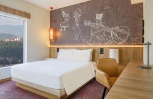 Ένα ή περισσότερα κρεβάτια σε δωμάτιο στο Hyatt Centric Soalteemode Kathmandu