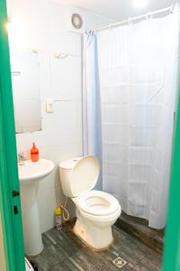 a bathroom with a toilet and a sink at Casa Blanca Hostel in Tarija