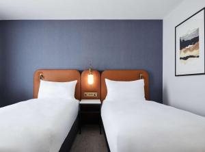 Postel nebo postele na pokoji v ubytování Hyatt Regency London Stratford