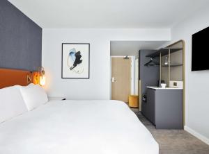 Postel nebo postele na pokoji v ubytování Hyatt Regency London Stratford