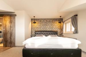Posteľ alebo postele v izbe v ubytovaní Padre Boutique Hotel