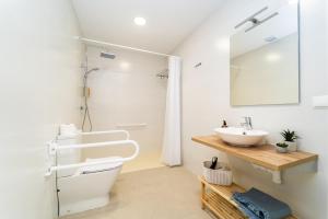 a bathroom with a sink and a mirror at Ca la Mar Villajoyosa in Villajoyosa +60 photos