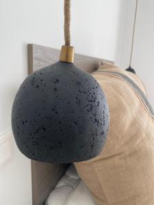 a black helmet sitting on top of a couch at APARTAMENTO A ESTRENAR en FOZ COFRADIA DELUXE in Foz +44 photos