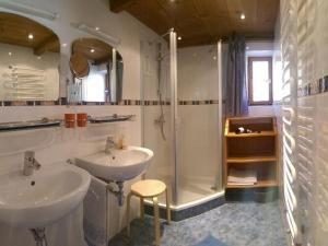 a bathroom with two sinks and a shower at Holiday apartment Haus Eberle No 2 in Bad Hindelang